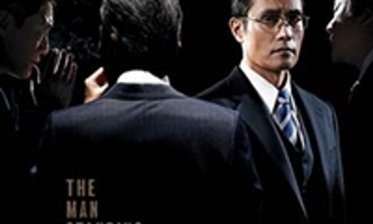 header image for The Man Standing Next