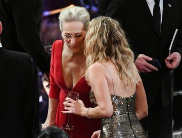 Jennifer Lawrence drinking wine at the Oscars
