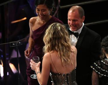Jennifer Lawrence drinking wine at the Oscars