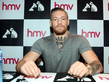 Conor McGregor signs copies of his DVD documentary 'Notorious' at HMV