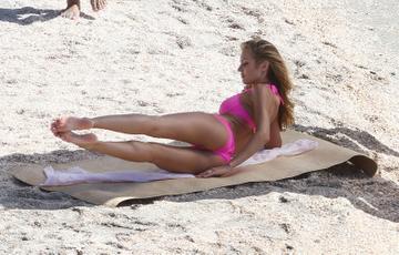 Candice Swanepoel poses at a photo shoot for Victoria's Secret Swimwear