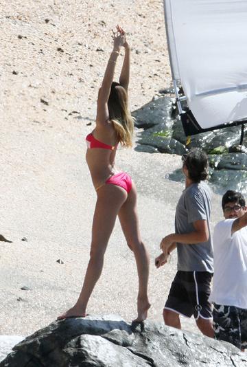 Candice Swanepoel poses at a photo shoot for Victoria's Secret Swimwear
