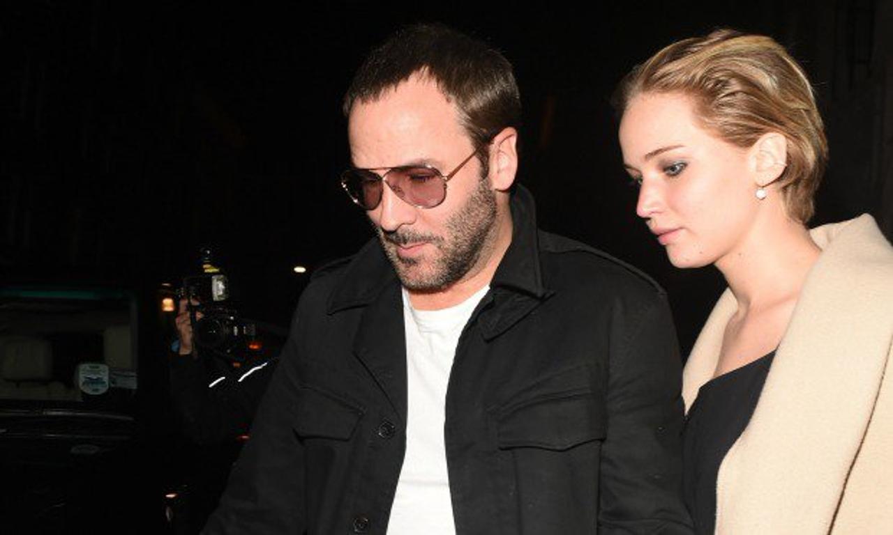 Jennifer Lawrence wears bauble on ring finger while out with Tom Ford.  Possibly engaged?!