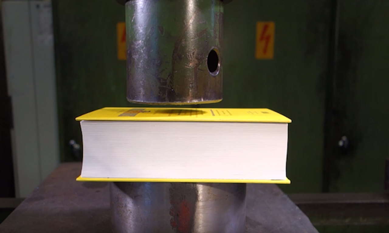 Why This Piece Of Paper 'Exploded' In A Hydraulic Press