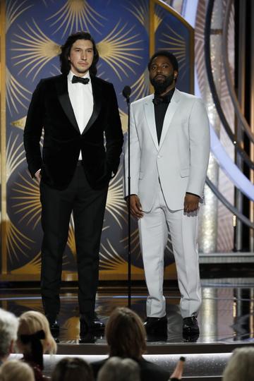 Presenters Adam Driver and John David Washington speak onstage during the 76th Annual Golden Globe Awards at The Beverly Hilton Hotel on January 06, 2019 in Beverly Hills, California.  (Photo by Paul Drinkwater/NBCUniversal via Getty Images)