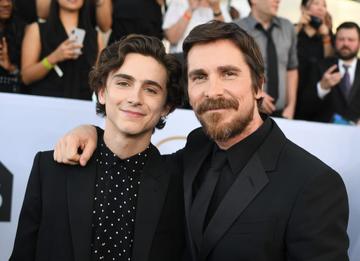 Outstanding Performance by a Male Actor in a Supporting Role for "Beautiful Boy" nominee Timothee Chalamet and Outstanding Performance by a Male Actor in a Leading Role for "Vice" nominee Christian Bale walks the red carpet at the 25th Annual Screen Actors Guild Awards at the Shrine Auditorium in Los Angeles on January 27, 2019. (Photo by Robyn Beck / AFP)        (Photo credit should read ROBYN BECK/AFP/Getty Images)