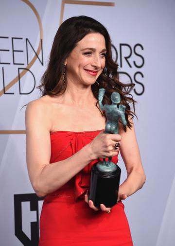 LOS ANGELES, CA - JANUARY 27:  Marin Hinkle poses in the press room with award for Outstanding Performance by an Ensemble in a Comedy Series in 'The Marvelous Mrs. Maisel ' during the 25th Annual Screen Actors Guild Awards at The Shrine Auditorium on January 27, 2019 in Los Angeles, California. 480645  (Photo by Gregg DeGuire/Getty Images for Turner)