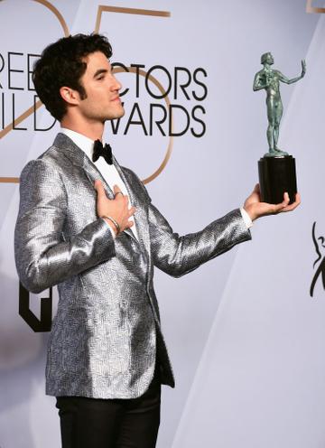 LOS ANGELES, CA - JANUARY 27:  Darren Criss poses in the press room with award for Outstanding Performance by a Male Actor in a Miniseries or Television Movie in 'The Assassination of Gianni Versace: American Crime Story' during the 25th Annual Screen Actors Guild Awards at The Shrine Auditorium on January 27, 2019 in Los Angeles, California. 480645  (Photo by Gregg DeGuire/Getty Images for Turner)