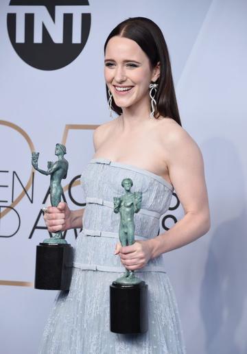 LOS ANGELES, CA - JANUARY 27:  Rachel Brosnahan poses in the press room with awards for Outstanding Performance by a Female Actor in a Comedy Series and Outstanding Performance by an Ensemble in a Comedy Series in The Marvelous Mrs. Maisel during the 25th Annual Screen Actors Guild Awards at The Shrine Auditorium on January 27, 2019 in Los Angeles, California. 480645  (Photo by Gregg DeGuire/Getty Images for Turner)