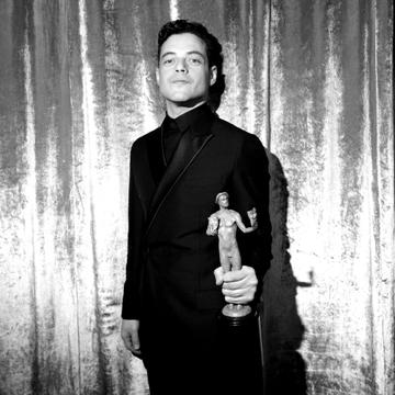 LOS ANGELES, CA - JANUARY 27: (EDITORS NOTE: Image has been shot in black and white. Color version not available.)  Rami Malek,  winner of Outstanding Performance by a Male Actor in a Leading Role in 'Bohemian Rhapsody' poses in the press room during the 25th Annual Screen Actors Guild Awards at The Shrine Auditorium on January 27, 2019 in Los Angeles, California. 480620  (Photo by Charley Gallay/Getty Images for Turner)