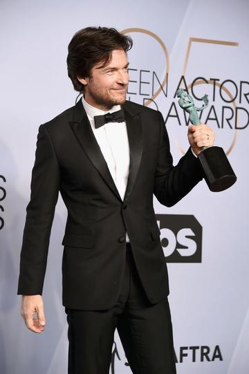 LOS ANGELES, CA - JANUARY 27:  Jason Bateman poses in the press room with award for Outstanding Performance by a Male Actor in a Drama Series in 'Ozark' during the 25th Annual Screen Actors Guild Awards at The Shrine Auditorium on January 27, 2019 in Los Angeles, California. 480645  (Photo by Gregg DeGuire/Getty Images for Turner)