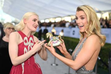 Actresses Betty Gilpin (R) and Gayle Rankin walk the red carpet at the 25th Annual Screen Actors Guild Awards at the Shrine Auditorium in Los Angeles on January 27, 2019. (Photo by Robyn Beck / AFP)        (Photo credit should read ROBYN BECK/AFP/Getty Images)