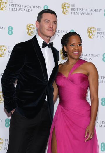 LONDON, ENGLAND - FEBRUARY 10:  Luke Evans (L) and Regina King pose in the press room during the EE British Academy Film Awards at Royal Albert Hall on February 10, 2019 in London, England. (Photo by Pascal Le Segretain/Getty Images)