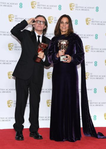 LONDON, ENGLAND - FEBRUARY 10:  Winners of the Outstanding Contribution To Cinema award, Stephen Woolley (L) and Elizabeth Karlsen pose in the press room during the EE British Academy Film Awards at Royal Albert Hall on February 10, 2019 in London, England. (Photo by Pascal Le Segretain/Getty Images)