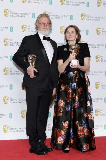 LONDON, ENGLAND - FEBRUARY 10:  Winners of Original Screenplay award for The Favourite, Tony McNamara (L) and Deborah Davis pose in the press room during the EE British Academy Film Awards at Royal Albert Hall on February 10, 2019 in London, England. (Photo by Pascal Le Segretain/Getty Images)