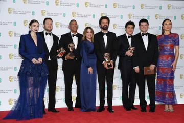 LONDON, ENGLAND - FEBRUARY 10:  (L-R) Presenter Lily Collins with winners of the Animated Film award for Spider-Man: Into the Spider-Verse, directors Rodney Rothman and Peter Ramsey, Christina Steinberg, director Bob Persichetti, screenwriter Phil Lord, Chris Miller and presenter Olga Kurylenko pose the press room during the EE British Academy Film Awards at Royal Albert Hall on February 10, 2019 in London, England. (Photo by Pascal Le Segretain/Getty Images)