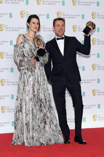LONDON, ENGLAND - FEBRUARY 10:  Winners of the Outstanding Debut By A British Writer, Director or Producer award, Lauren Dark (L) and Micheal Pearce pose in the press room during the EE British Academy Film Awards at Royal Albert Hall on February 10, 2019 in London, England. (Photo by Pascal Le Segretain/Getty Images)