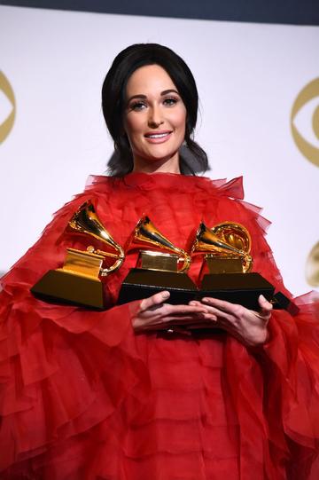 LOS ANGELES, CALIFORNIA - FEBRUARY 10: Kacey Musgraves, winner of Album of the Year, Best Country Album, Best Country Song, and Best Country Solo Performance, poses in the press room during the 61st Annual GRAMMY Awards at Staples Center on February 10, 2019 in Los Angeles, California. (Photo by Amanda Edwards/Getty Images)
