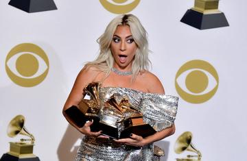 TOPSHOT - Singer/songwriter Lady Gaga poses with her award for Best Pop Solo Performance with "Joanne", Best Pop Duo/Group Performance "Shallow" and Best Song Written for Visual Media "Shallow" in the press room during the 61st Annual Grammy Awards on February 10, 2019, in Los Angeles. (Photo by FREDERIC J. BROWN / AFP)        (Photo credit should read FREDERIC J. BROWN/AFP/Getty Images)