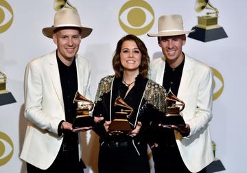 Singer/songwriter Brandi Carlile (C), with musicians Tim and Phil Hanseroth, poses with her awards for Best American Roots Performance "The Joke", Best American Roots song "The joke" and Best Americana Album "By the Way, I Forgive You" in the press room during the 61st Annual Grammy Awards on February 10, 2019, in Los Angeles. (Photo by FREDERIC J. BROWN / AFP)        (Photo credit should read FREDERIC J. BROWN/AFP/Getty Images)