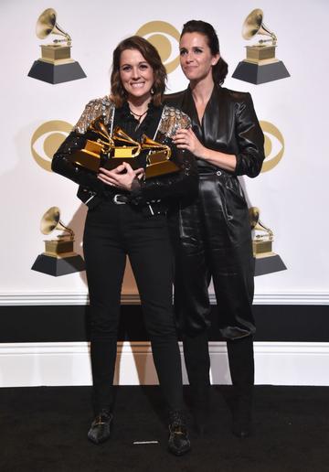 LOS ANGELES, CA - FEBRUARY 10:  Singer/songwriter Brandi Carlile (L), with British actress Catherine Shepherd, poses with her awards for Best American Roots Performance 'The Joke', Best American Roots song 'The joke' and Best Americana Album 'By the Way, I Forgive You' poses in the press room during the 61st Annual GRAMMY Awards at Staples Center on February 10, 2019 in Los Angeles, California.  (Photo by Alberto E. Rodriguez/Getty Images for The Recording Academy)