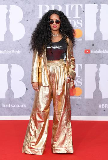 H.E.R. on the red carpet of The BRIT Awards 2019 held at The O2 Arena on February 20, 2019 in London. (Photo by: WireImage)