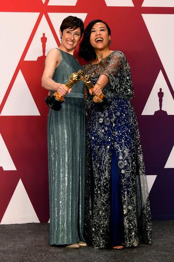 HOLLYWOOD, CALIFORNIA - FEBRUARY 24: Becky Neiman-Cobb (L) and Domee Shi, winners of Best Animated Short Film for "Bao," pose in the press room during the 91st Annual Academy Awards at Hollywood and Highland on February 24, 2019 in Hollywood, California. (Photo by Frazer Harrison/Getty Images)
