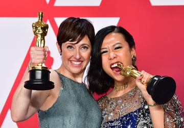 Best Animated Short Film winners for "Bao" Domee Shi (R) and Becky Neiman-Cobb pose in the press room with their Oscars during the 91st Annual Academy Awards at the Dolby Theatre in Hollywood, California on February 24, 2019. (Photo by FREDERIC J. BROWN / AFP)        (Photo credit should read FREDERIC J. BROWN/AFP/Getty Images)
