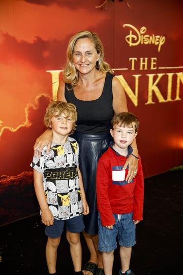 Debbie O'Donnell pictured with Sam Carroll (6) and Henry Cox (6) at a special family screening of Disney’s THE LION KING at the Odeon Point Village. Picture: Andres Poveda