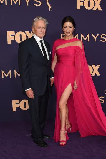 Welsh actress Catherine Zeta-Jones (R) and husband US actor Michael Douglas arrive for the 71st Emmy Awards at the Microsoft Theatre in Los Angeles on September 22, 2019. (Photo by Robyn Beck /Getty Images)