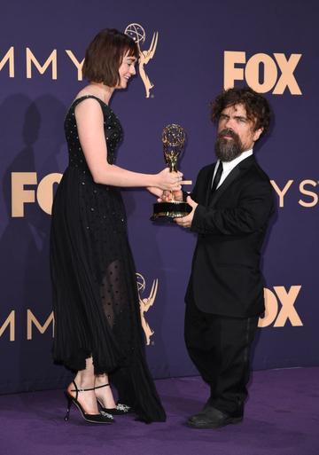British actress Maisie Williams and US actor Peter Dinklage pose with the Emmy for Outstanding Drama Series "Game Of Thrones" during the 71st Emmy Awards at the Microsoft Theatre in Los Angeles on September 22, 2019. (Photo by Robyn Beck/Getty Images)