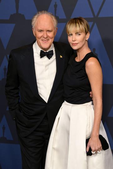 John Lithgow and Charlize Theron attend the Academy Of Motion Picture Arts And Sciences' 11th Annual Governors Awards at The Ray Dolby Ballroom at Hollywood & Highland Center in Hollywood, California. (Photo by Kevin Winter/Getty Images)