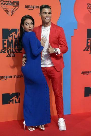 Juventus' Portuguese forward Cristiano Ronaldo (R) and his wife Georgina Rodriguez pose on the red carpet upon their arrival to the MTV Europe Music Awards at the FIBES Conference and Exhibition Centre of Seville on November 3, 2019. (Photo by CRISTINA QUICLER/AFP via Getty Images)