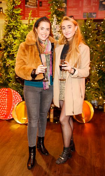 Sorcha and Niamh O'Connor pictured at the M&S Christmas Market inspired press show in the M&S Rooftop Café,  Grafton Street to celebrate the M&S Christmas food collection. Picture: Andres Poveda