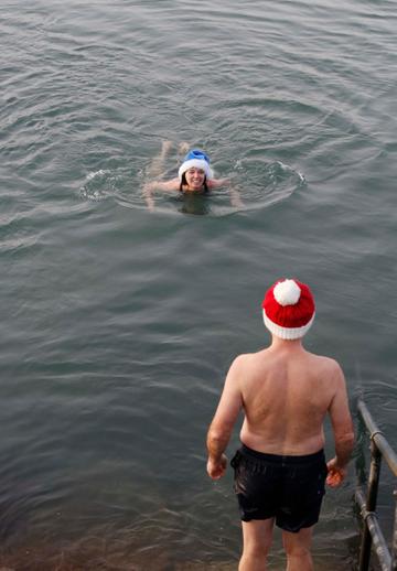 25/12/2019. Forty Foot Xmas Swim. Hundreds of people turned up at the Fortyfoot bathing spot in Sandycove, for the annual Xmas Day swim. Pictured are (LtoR) Frank and Heather Devitt from Maynooth at the Forty Foot Xmas Swim. Photo:RollingNews.ie