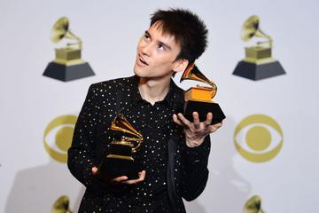 British singer Jacob Collier poses in the press room with the awards for Best Arrangement, Instrumental or A Capella for "Moon River" and Best Arrangement, Instrumental or Vocals for "All night long" during the 62nd Annual Grammy Awards on January 26, 2020, in Los Angeles. (Photo by FREDERIC J. BROWN / AFP) (Photo by FREDERIC J. BROWN/AFP via Getty Images)