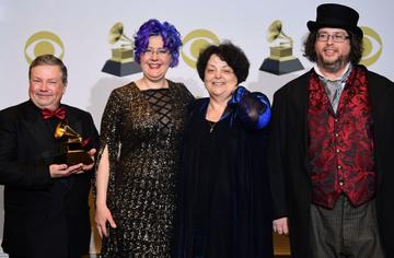 (From L) Victor Ledin, Nadia Shpachenko, Marina A. Ledin and Barry Werger-Gottesman pose with the award for Best Classical Compendium for "The Poetry of Places" in the press room during the 62nd Annual Grammy Awards on January 26, 2020, in Los Angeles. (Photo by FREDERIC J. BROWN / AFP) (Photo by FREDERIC J. BROWN/AFP via Getty Images)
