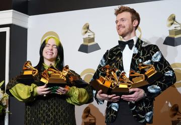 (L-R) Billie Eilish, winner of Record of the Year for "Bad Guy", Album of the Year for "when we all fall asleep, where do we go?", Song of the Year for "Bad Guy", Best New Artist and Best Pop Vocal Album for "when we all fall asleep, where do we go?", and Finneas O'Connell, winner of Best Engineered Album Non-Classical for "when we all fall asleep, where do we go?", Song of the Year for "Bad Guy", and Producer Of The Year Non-Classical pose in the press room during the 62nd Annual GRAMMY Awards at Staples Center on January 26, 2020 in Los Angeles, California. (Photo by Rachel Luna/FilmMagic)