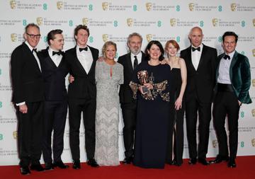 (L to R)  Callum McDougall, Dean-Charles Chapman, George MacKay, Jayne-Ann Tenggren, Sir Sam Mendes, Dame Pippa Harris, Krysty Wilson-Cairns, Mark Strong and Andrew Scott, accepting the Best Film award for "1917", pose in the Winners Room at the EE British Academy Film Awards 2020 at Royal Albert Hall on February 2, 2020 in London, England. (Photo by David M. Benett/Dave Benett/Getty Images)