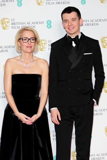Gillian Anderson and Asa Butterfield pose in the Winners Room at the EE British Academy Film Awards 2020 at Royal Albert Hall on February 2, 2020 in London, England. (Photo by David M. Benett/Dave Benett/Getty Images)