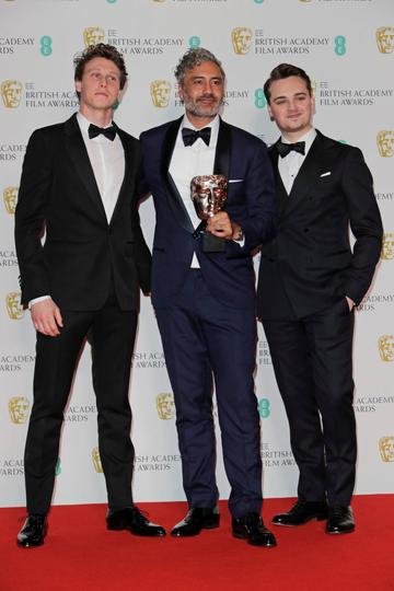 (L to R)  George MacKay, Taika Waititi, winner of the Best Adapted Screenplay award for "Jojo Rabbit", and Dean-Charles Chapman pose in the Winners Room at the EE British Academy Film Awards 2020 at Royal Albert Hall on February 2, 2020 in London, England. (Photo by David M. Benett/Dave Benett/Getty Images)