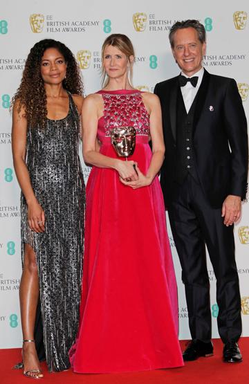 (L to R)  Naomie Harris, Laura Dern, winner of Best Supporting Actress for "Marriage Story", and Richard E. Grant pose in the Winners Room at the EE British Academy Film Awards 2020 at Royal Albert Hall on February 2, 2020 in London, England. (Photo by David M. Benett/Dave Benett/Getty Images)
