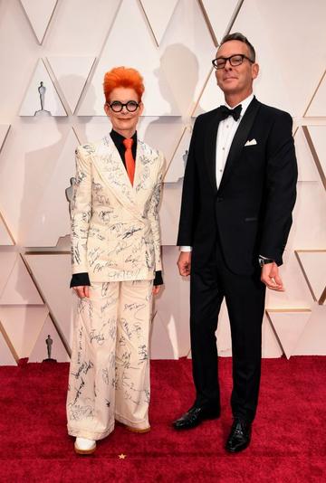 British costume designer Sandy Powell and a guest arrive for the 92nd Oscars at the Dolby Theatre in Hollywood, California on February 9, 2020. (Photo by Robyn Beck / AFP) (Photo by ROBYN BECK/AFP via Getty Images)