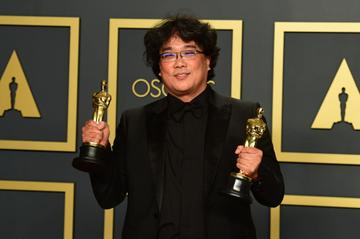 South Korean director Bong Joon-ho poses in the press room with the Oscars for "Parasite" during the 92nd Oscars at the Dolby Theater in Hollywood, California on February 9, 2020. - Bong Joon-ho won for Best Director, Best Movie, Best International Feature Film and Best Original Screenplay for "Parasite". (Photo by FREDERIC J. BROWN / AFP) (Photo by FREDERIC J. BROWN/AFP via Getty Images)