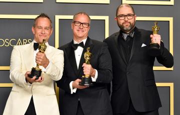 Filmmakers Jonas Rivera, Mark Nielsen and Josh Cooley, winners of the Animated Feature Film award for “Toy Story 4,”  pose in the press room during the 92nd Annual Academy Awards at Hollywood and Highland on February 09, 2020 in Hollywood, California. (Photo by Amy Sussman/Getty Images)
