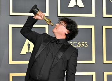 Director Bong Joon-ho, winner of the Original Screenplay, International Feature Film, Directing, and Best Picture  award for “Parasite,” poses in the press room during the 92nd Annual Academy Awards at Hollywood and Highland on February 09, 2020 in Hollywood, California. (Photo by Amy Sussman/Getty Images)