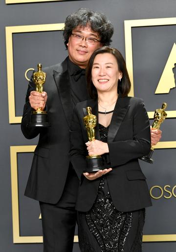 Director Bong Joon-ho and producer Kwak Sin-ae, winners of the Original Screenplay, International Feature Film, Directing, and Best Picture awards for “Parasite,”  pose in the press room during the 92nd Annual Academy Awards at Hollywood and Highland on February 09, 2020 in Hollywood, California. (Photo by Amy Sussman/Getty Images)