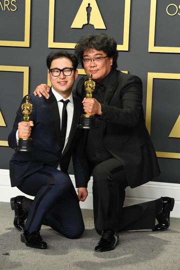 Bong Joon-ho (R) and  Han Jin-won, winners of the Original Screenplay award for "Parasite,"  poses in the press room during the 92nd Annual Academy Awards at Hollywood and Highland on February 09, 2020 in Hollywood, California. (Photo by Steve Granitz/WireImage )