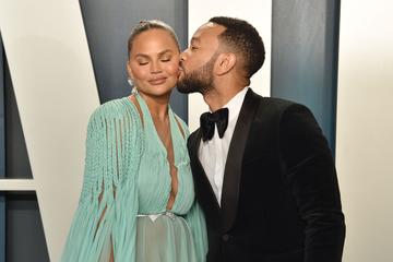 Chrissy Teigen and John Legend attend the 2020 Vanity Fair Oscar Party at Wallis Annenberg Center for the Performing Arts on February 09, 2020 in Beverly Hills, California. (Photo by David Crotty/Patrick McMullan via Getty Images)