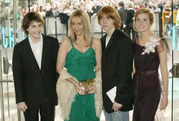 Actor Daniel Radcliffe writer J K Rowling and actors Rupert Grint and Emma Watson attend the UK Premiere of "Harry Potter And The Prisoner Of Azkaban" at the Odeon Leicester Square on May 30, 2004 in London. The film is the third celluloid instalment of J K Rowling's series of books. (Photo by Dave Hogan/Getty Images)